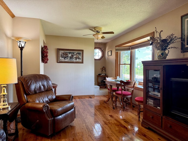 15467 Twilight Rd, Onamia, MN 56359 - living area with hardwood / wood-style flooring, ceiling fan, and a textured ceiling