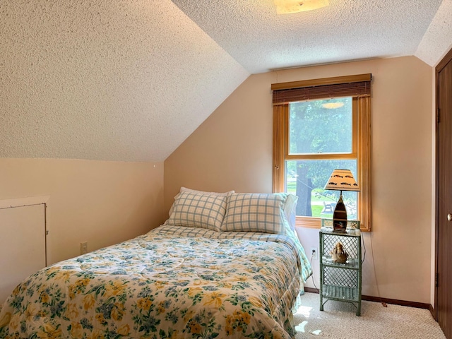 15467 Twilight Rd, Onamia, MN 56359 - bedroom with vaulted ceiling, a textured ceiling, and carpet floors