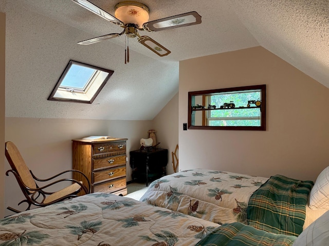 15467 Twilight Rd, Onamia, MN 56359 - bedroom featuring vaulted ceiling, a textured ceiling, a skylight, ceiling fan, and multiple windows