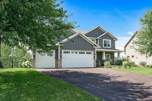 7804 Stafford Trl, Savage, MN 55378 - craftsman-style house featuring board and batten siding, driveway, stone siding, and an attached garage