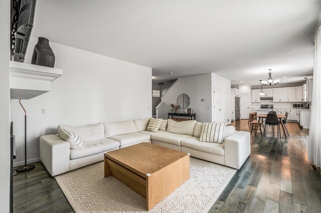 7804 Stafford Trl, Savage, MN 55378 - living room featuring a chandelier, dark wood finished floors, and recessed lighting