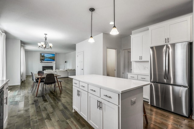 7804 Stafford Trl, Savage, MN 55378 - kitchen featuring freestanding refrigerator, a chandelier, dark wood-style flooring, a kitchen island, and white cabinets