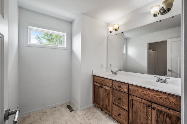 7804 Stafford Trl, Savage, MN 55378 - bathroom with double vanity and marble look tile flooring