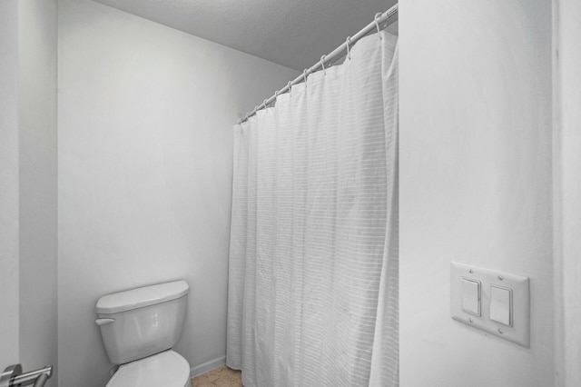 7804 Stafford Trl, Savage, MN 55378 - bathroom featuring toilet and a shower with shower curtain