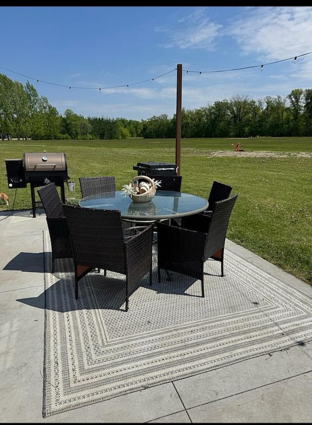 34463 Green Valley Rd SE, Woodside Twp, MN 56736 - view of patio / terrace with outdoor dining space and a grill