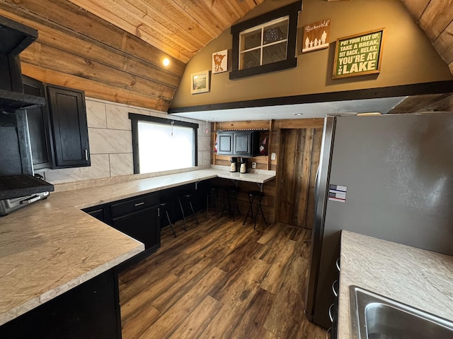 34463 Green Valley Rd SE, Woodside Twp, MN 56736 - kitchen featuring freestanding refrigerator, lofted ceiling, dark wood-style floors, wooden ceiling, and dark cabinets
