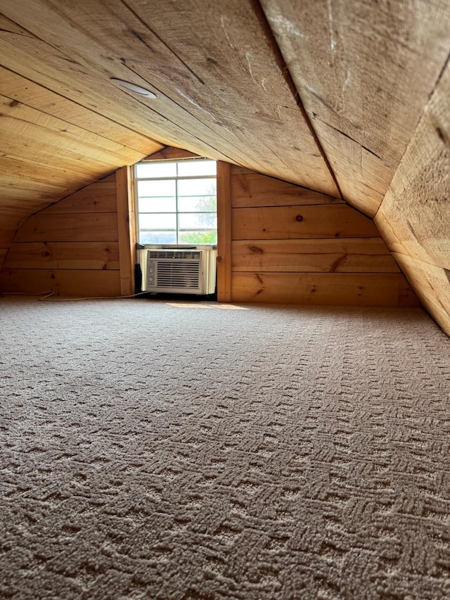 34463 Green Valley Rd SE, Woodside Twp, MN 56736 - bonus room featuring cooling unit, lofted ceiling, wooden walls, carpet flooring, and wooden ceiling