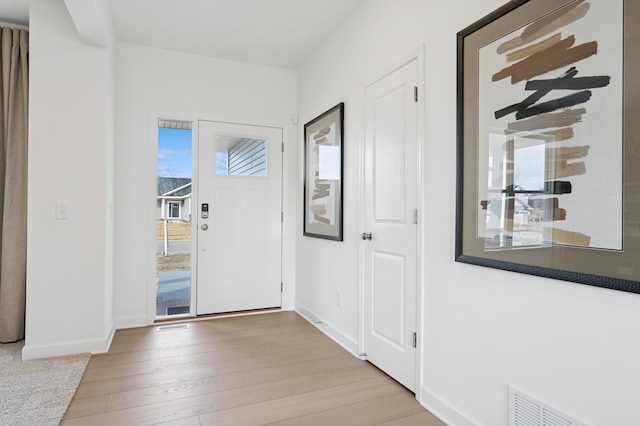 18695 Kennedy St NW, Elk River, MN 55330 - foyer featuring light wood-style floors and baseboards