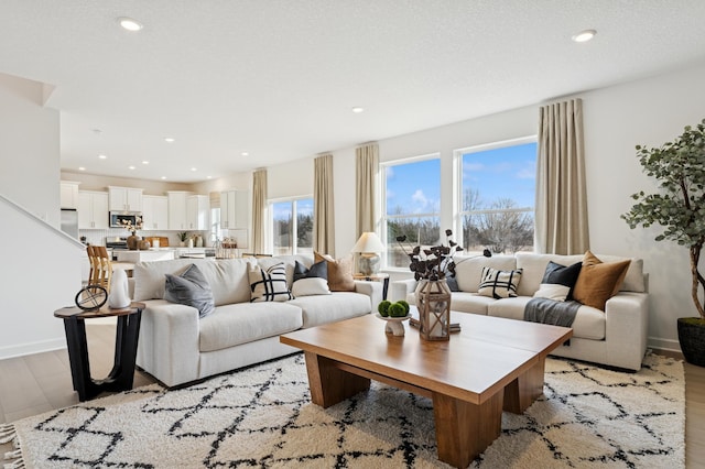18695 Kennedy St NW, Elk River, MN 55330 - living room featuring light wood-type flooring and recessed lighting