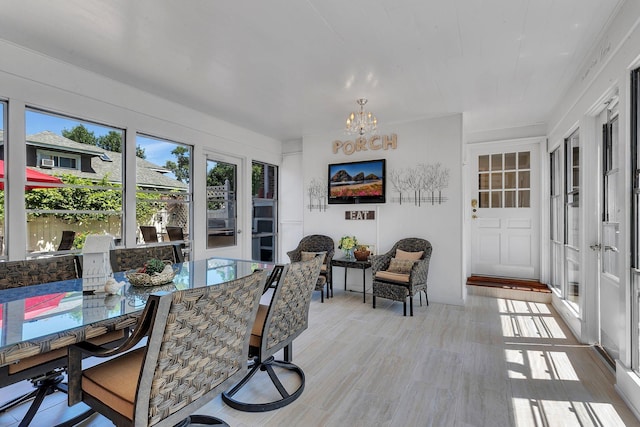 426 Armstrong Ave, Litchfield, MN 55355 - sunroom / solarium featuring french doors and a chandelier
