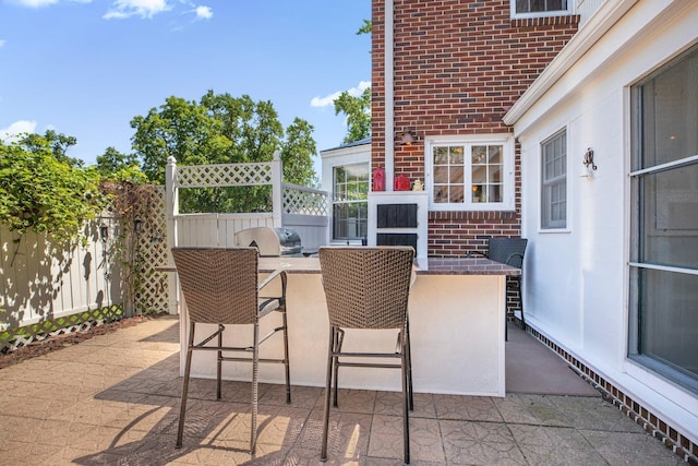 426 Armstrong Ave, Litchfield, MN 55355 - view of patio / terrace featuring an outdoor kitchen