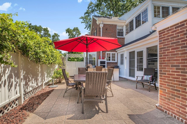 426 Armstrong Ave, Litchfield, MN 55355 - fenced backyard with a patio area and outdoor dining space