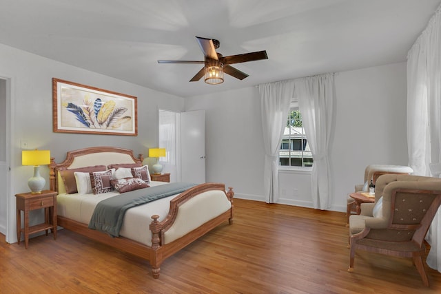 426 Armstrong Ave, Litchfield, MN 55355 - bedroom with light wood-style flooring and a ceiling fan