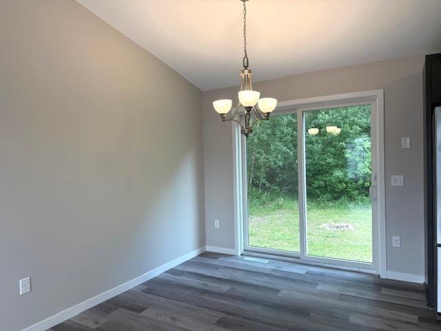 1312 Natures Trl, Alexandria, MN 56308 - unfurnished dining area with a chandelier and dark wood finished floors