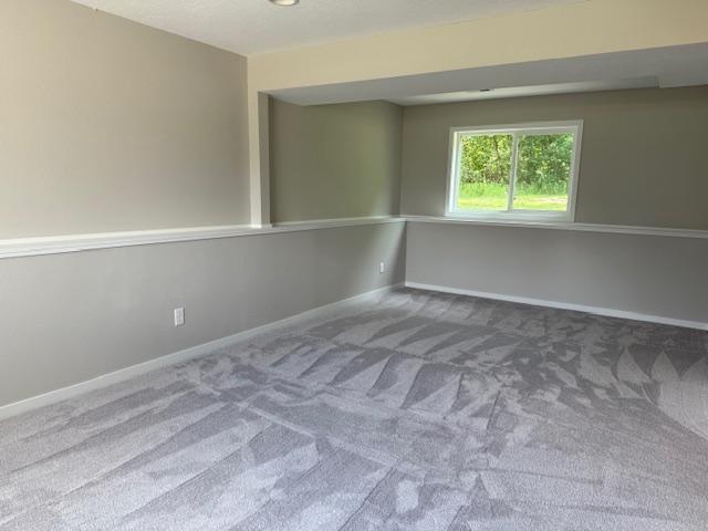 1312 Natures Trl, Alexandria, MN 56308 - carpeted spare room featuring baseboards