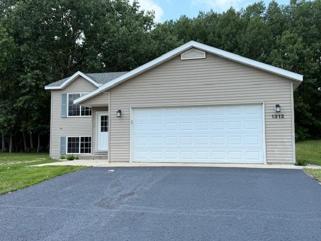 1312 Natures Trl, Alexandria, MN 56308 - view of front of home featuring a garage