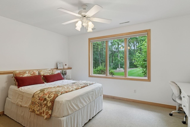 100 River Bluff Pl NW, Rochester, MN 55901 - bedroom with light colored carpet, an office area, and a ceiling fan