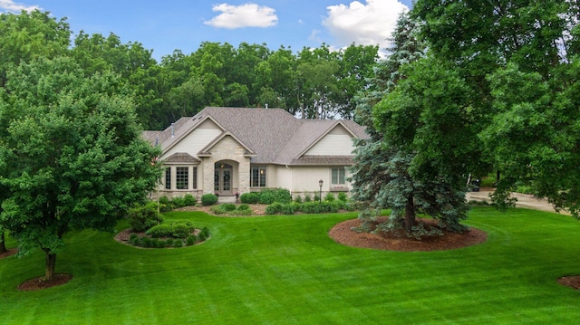 100 River Bluff Pl NW, Rochester, MN 55901 - view of front of property featuring stone siding, a front yard, and french doors