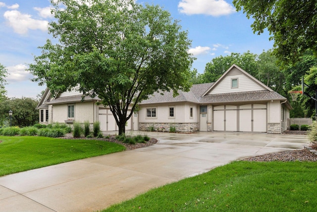 100 River Bluff Pl NW, Rochester, MN 55901 - view of front of property featuring stone siding, concrete driveway, a front lawn, and an attached garage