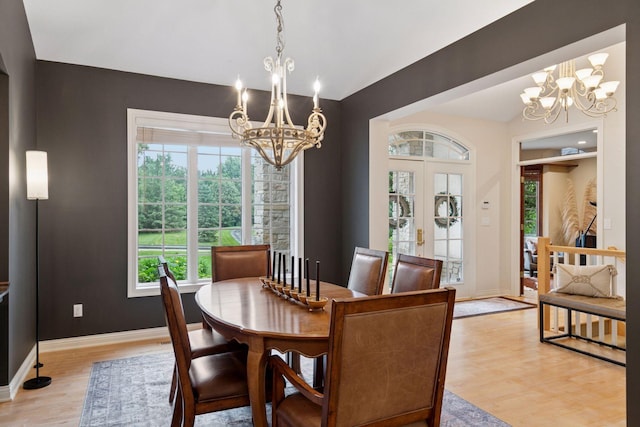100 River Bluff Pl NW, Rochester, MN 55901 - dining area with a chandelier and light wood-style floors