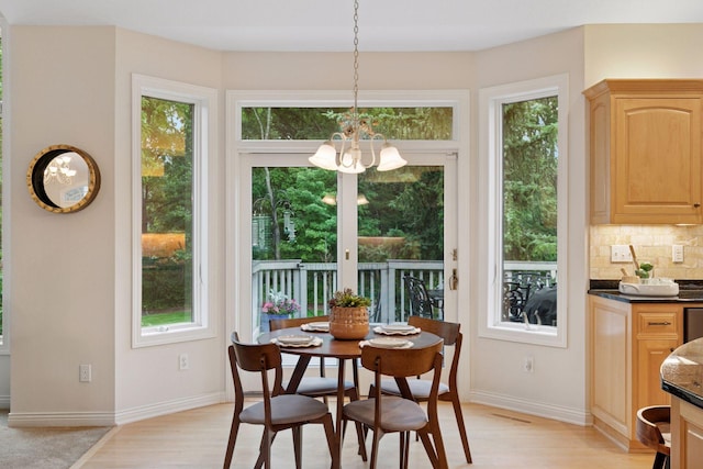 100 River Bluff Pl NW, Rochester, MN 55901 - dining room featuring a chandelier, light wood-style floors, and plenty of natural light