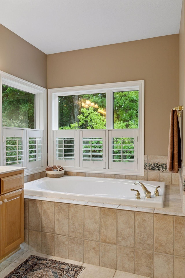 100 River Bluff Pl NW, Rochester, MN 55901 - full bath featuring a bath, vanity, and tile patterned flooring