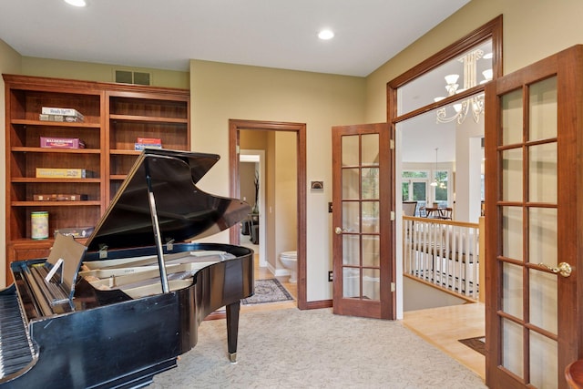 100 River Bluff Pl NW, Rochester, MN 55901 - carpeted office space with a chandelier, french doors, and recessed lighting