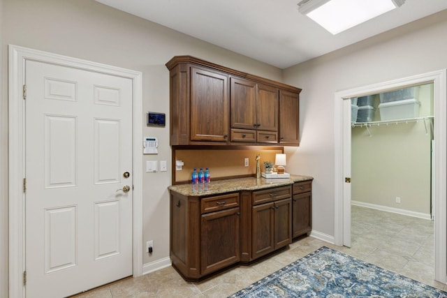 100 River Bluff Pl NW, Rochester, MN 55901 - bar area featuring baseboards and light tile patterned floors