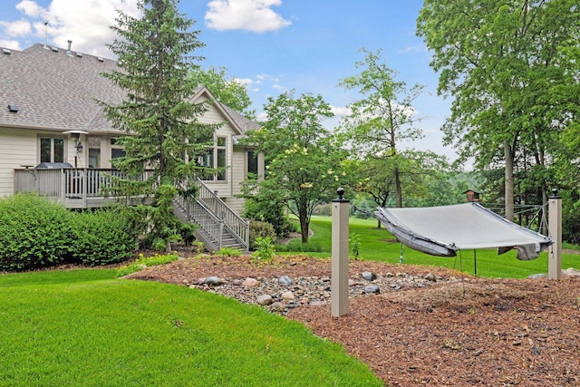 100 River Bluff Pl NW, Rochester, MN 55901 - view of grassy yard with a deck and stairs