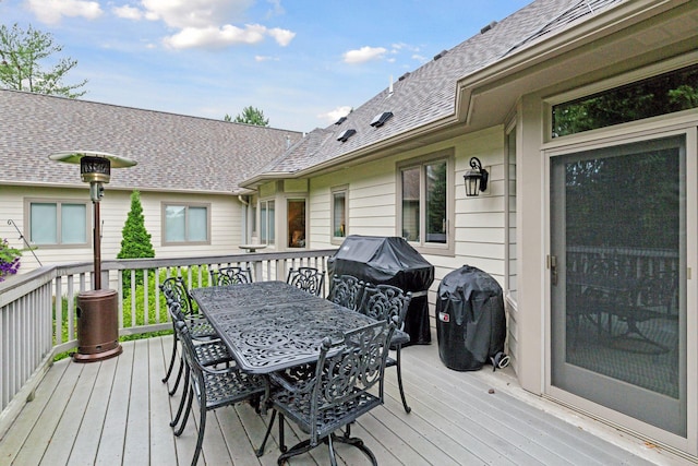 100 River Bluff Pl NW, Rochester, MN 55901 - wooden deck with outdoor dining space and a grill