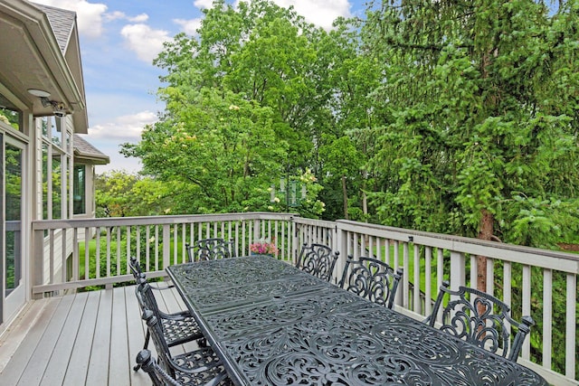 100 River Bluff Pl NW, Rochester, MN 55901 - wooden deck featuring outdoor dining space and view of wooded area