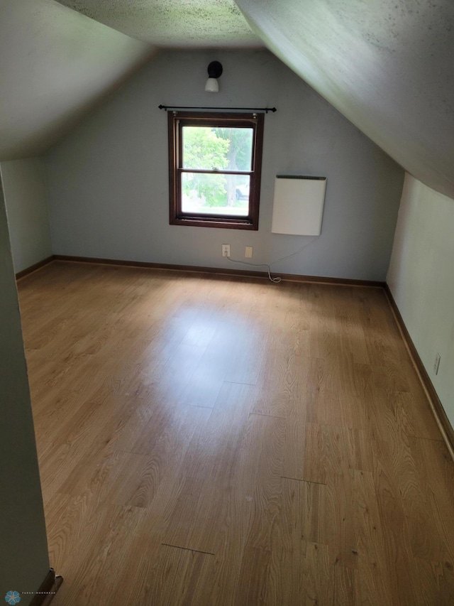 1140 19th St N, Fargo, ND 58102 - bonus room featuring wood finished floors and lofted ceiling