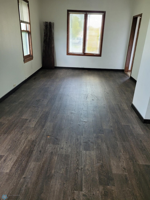 1140 19th St N, Fargo, ND 58102 - unfurnished room with dark wood-style floors and healthy amount of natural light