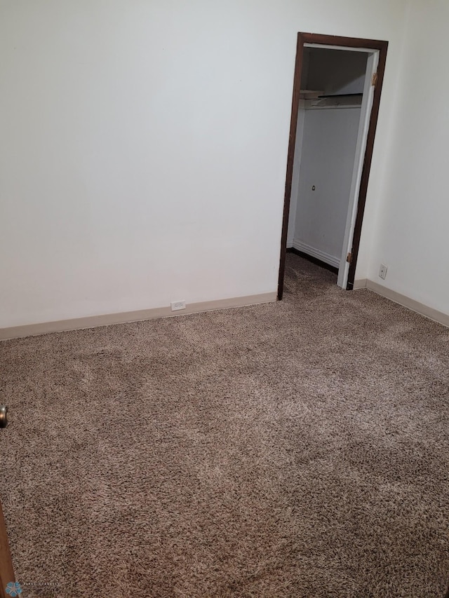 1140 19th St N, Fargo, ND 58102 - unfurnished bedroom featuring carpet and baseboards