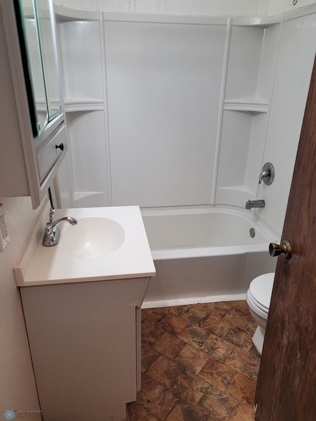 1140 19th St N, Fargo, ND 58102 - bathroom featuring vanity, stone finish flooring, and shower / bathtub combination