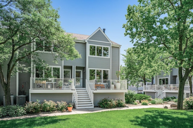 1575 Wayzata Blvd Unit A, Long Lake, MN 55356 - back of house featuring stairs, a yard, and a deck