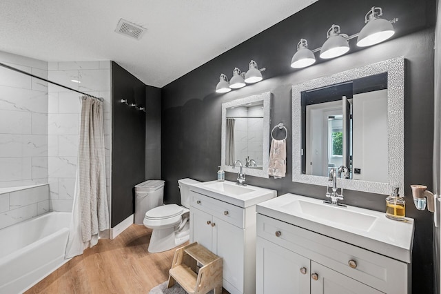 1575 Wayzata Blvd Unit A, Long Lake, MN 55356 - bathroom featuring wood finished floors, two vanities, and shower / tub combo with curtain