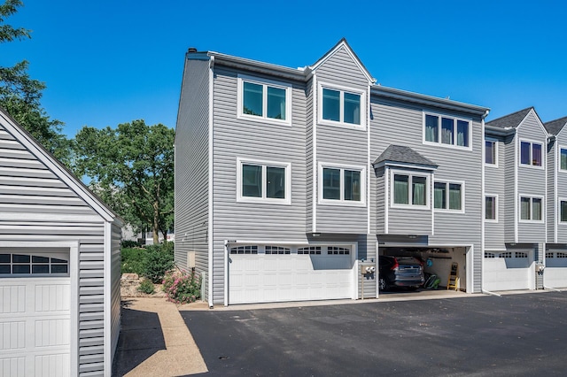 1575 Wayzata Blvd Unit A, Long Lake, MN 55356 - view of side of home featuring asphalt driveway