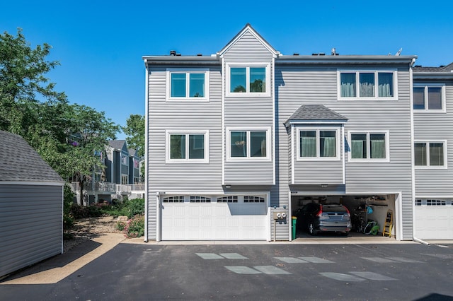 1575 Wayzata Blvd Unit A, Long Lake, MN 55356 - back of property featuring an attached garage and driveway