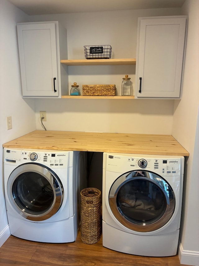 410 Atlantic Ave W, Grove City, MN 56243 - laundry room with wood finished floors and washer and clothes dryer