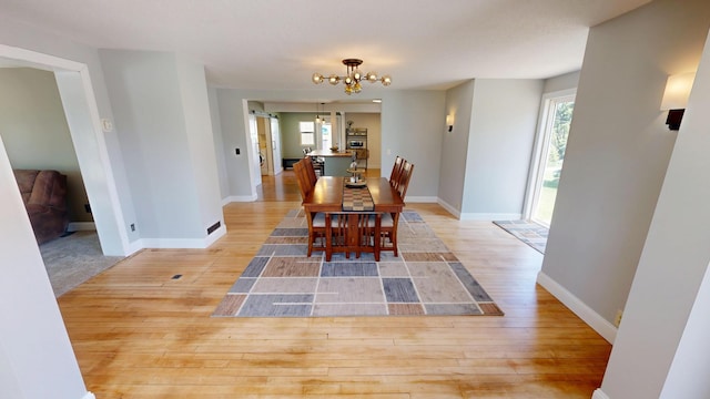 410 Atlantic Ave W, Grove City, MN 56243 - dining room featuring a chandelier and wood finished floors