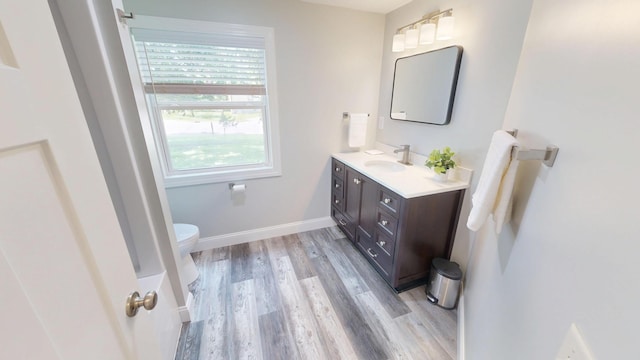 410 Atlantic Ave W, Grove City, MN 56243 - bathroom with vanity and wood finished floors