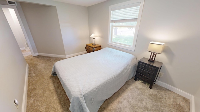 410 Atlantic Ave W, Grove City, MN 56243 - bedroom featuring light colored carpet and baseboards