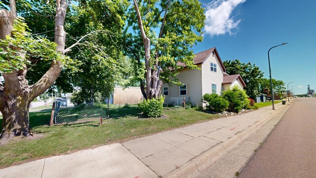 410 Atlantic Ave W, Grove City, MN 56243 - view of property exterior with a yard