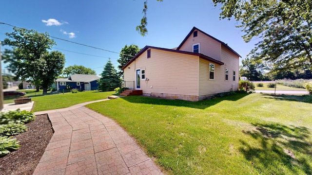 410 Atlantic Ave W, Grove City, MN 56243 - view of property exterior with a lawn