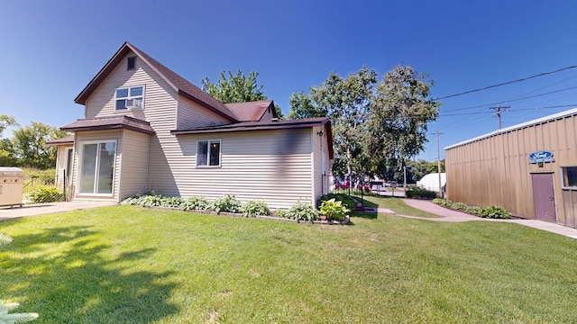 410 Atlantic Ave W, Grove City, MN 56243 - view of home's exterior featuring a lawn