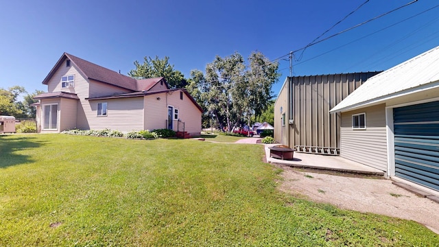 410 Atlantic Ave W, Grove City, MN 56243 - view of green lawn with a patio