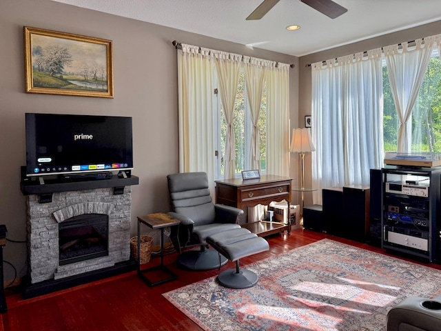 18611 327th Ave, Isle, MN 56342 - sitting room featuring wood finished floors, ceiling fan, a stone fireplace, and recessed lighting