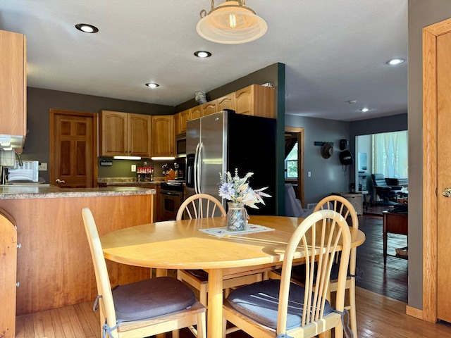 18611 327th Ave, Isle, MN 56342 - dining area with light wood finished floors and recessed lighting