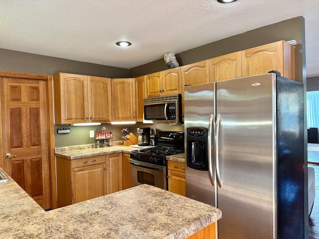 18611 327th Ave, Isle, MN 56342 - kitchen with stainless steel appliances, light countertops, and a textured ceiling